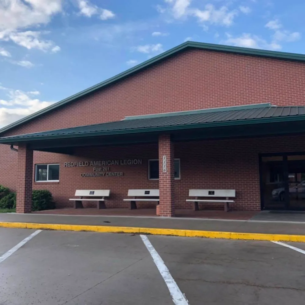 Brick exterior and covered entrance of the Redfield American Legion Post 261 Community Center.