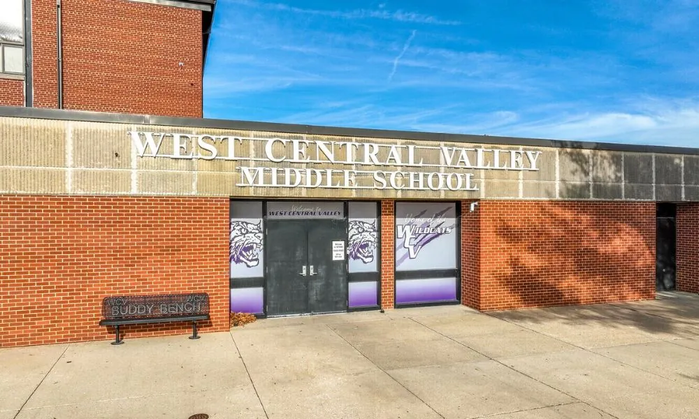 West Central Valley Middle School entrance in Redfield, a red brick building with the Wildcats mascot on the doors.