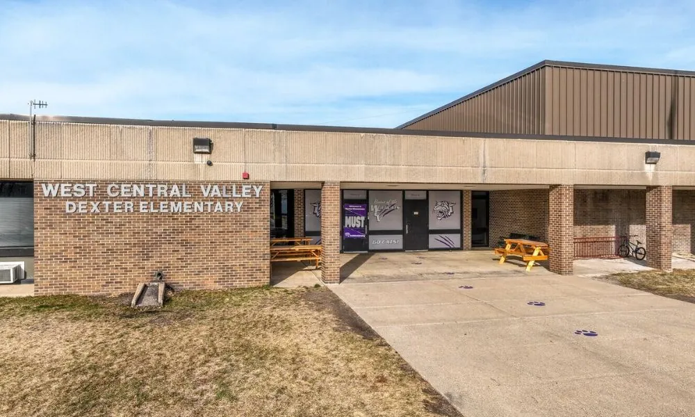 West Central Valley Dexter Elementary entrance, a brick building with the school name in silver lettering.