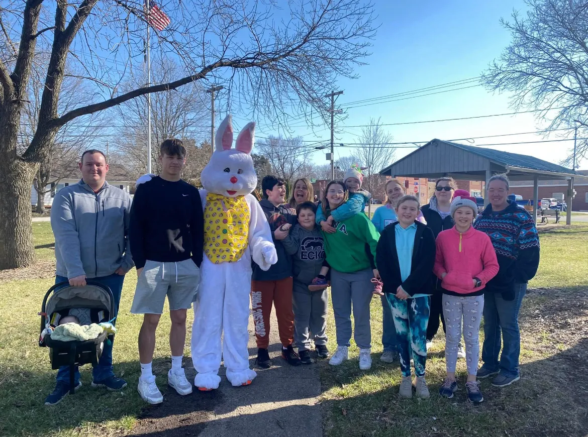 Easter Bunny posing with Redfield families and kids on a sunny spring day in the park