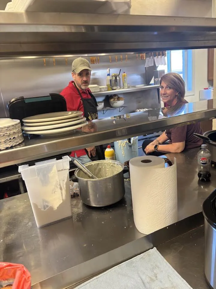 Volunteers cooking in the Legion Hall kitchen during Saturday breakfast