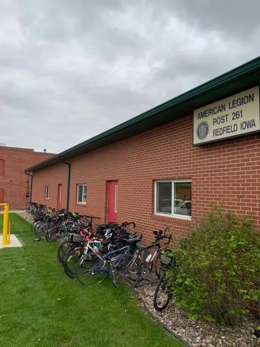 American Legion Post 261 brick hall on Thomas Street in Redfield with bicycles parked along the side