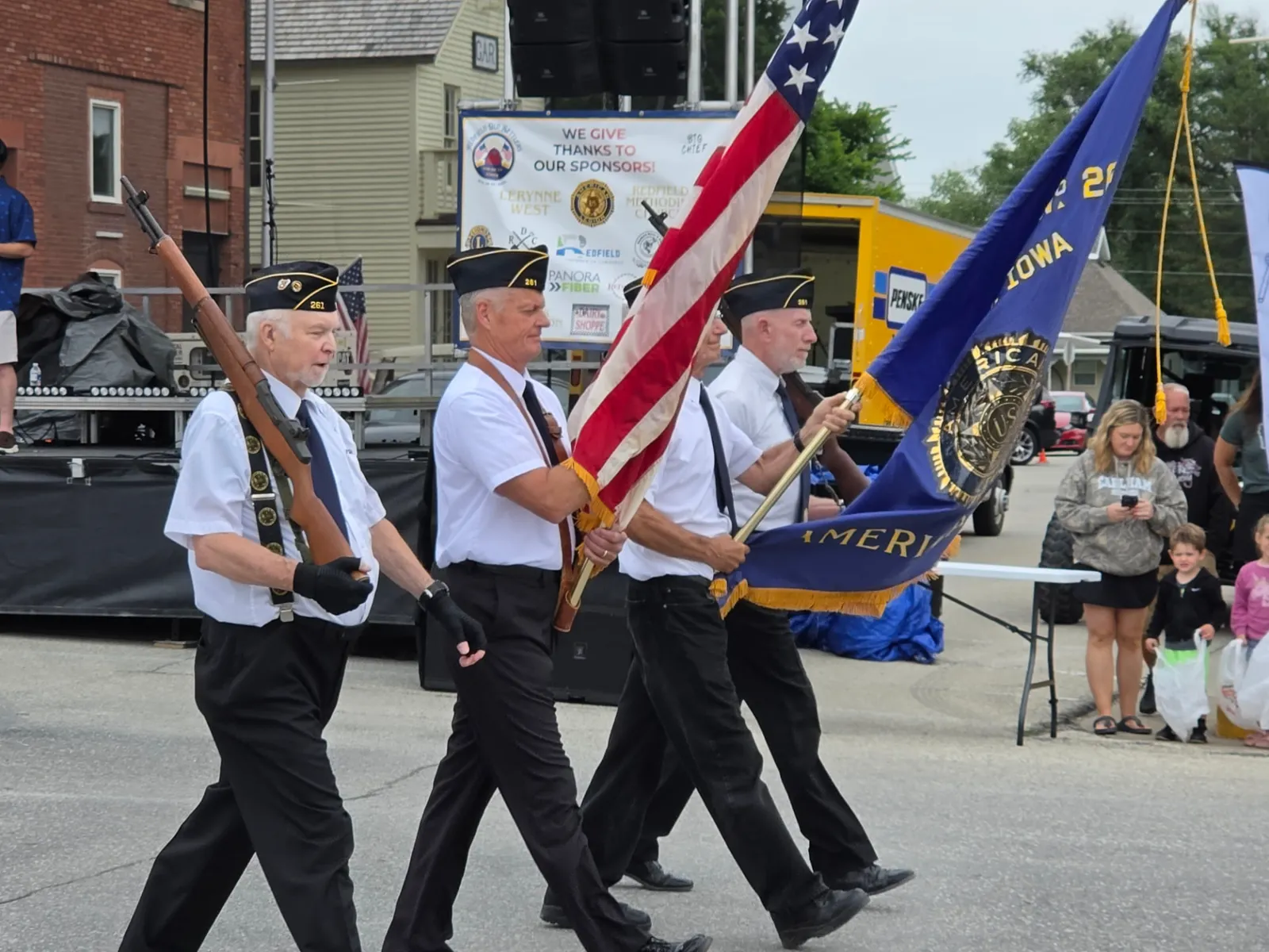 American Legion color guard marching with the American flag in the Redfield Old Settlers Days parade
